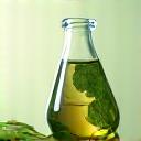 Ampoule de laboratoire avec des feuilles autour, symbolisant les formules exclusives